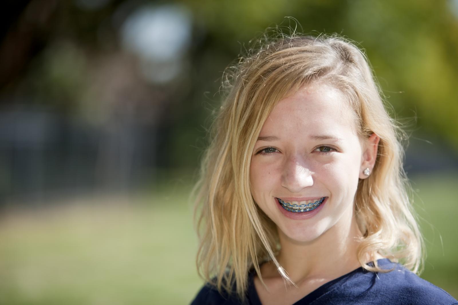 Young girl smiling with braces